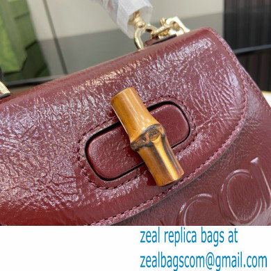 Gucci Bamboo 1947 mini top handle bag with Debossed Gucci logo 786482 burgundy 2024